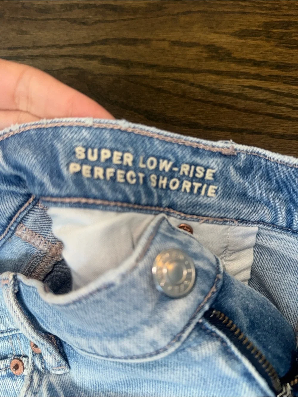 American Eagle Outfitters Super Low Rise Perfect Shortie light Wash distressed